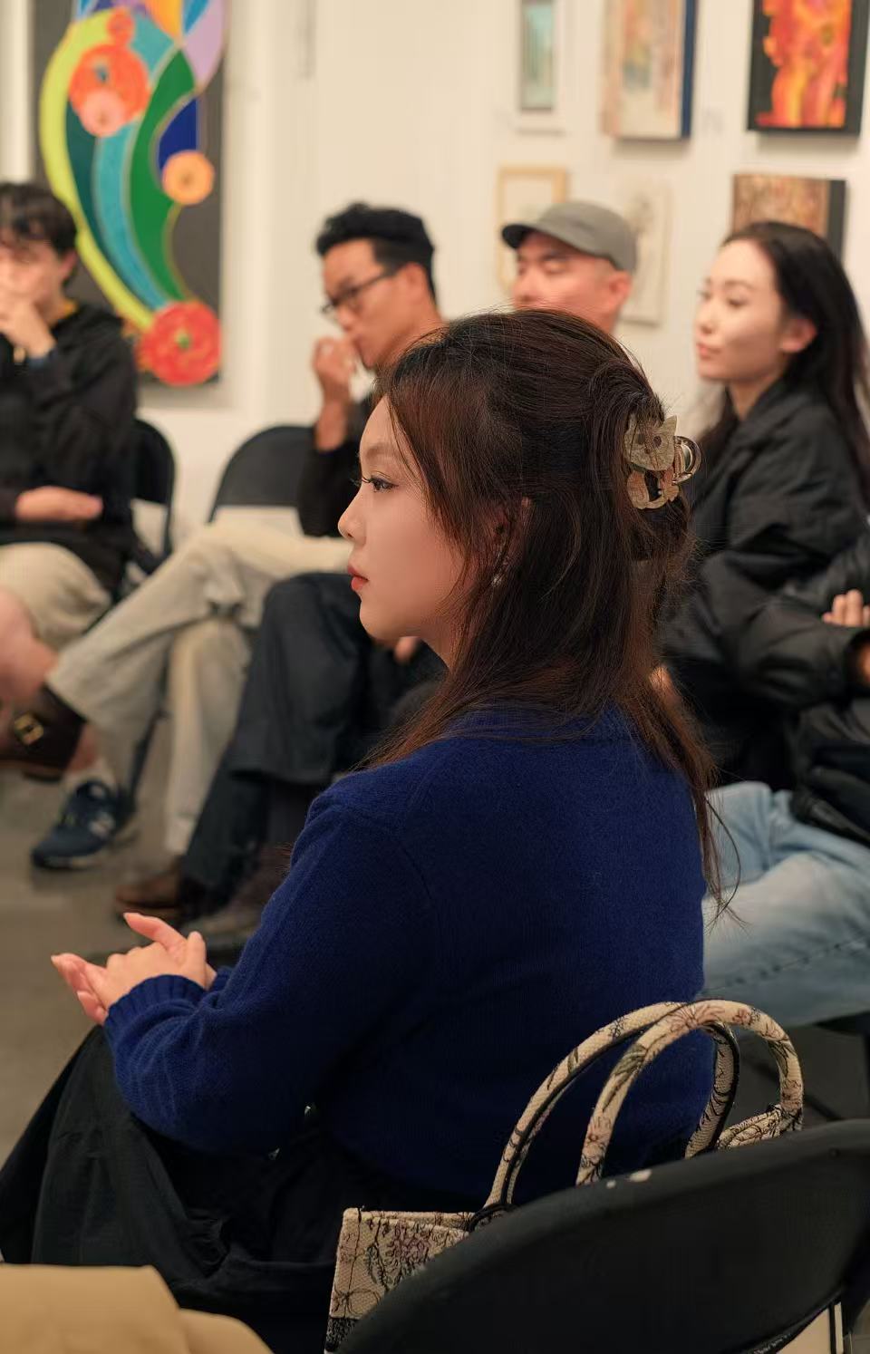 Linli Wang in conversation during an AIC gathering.