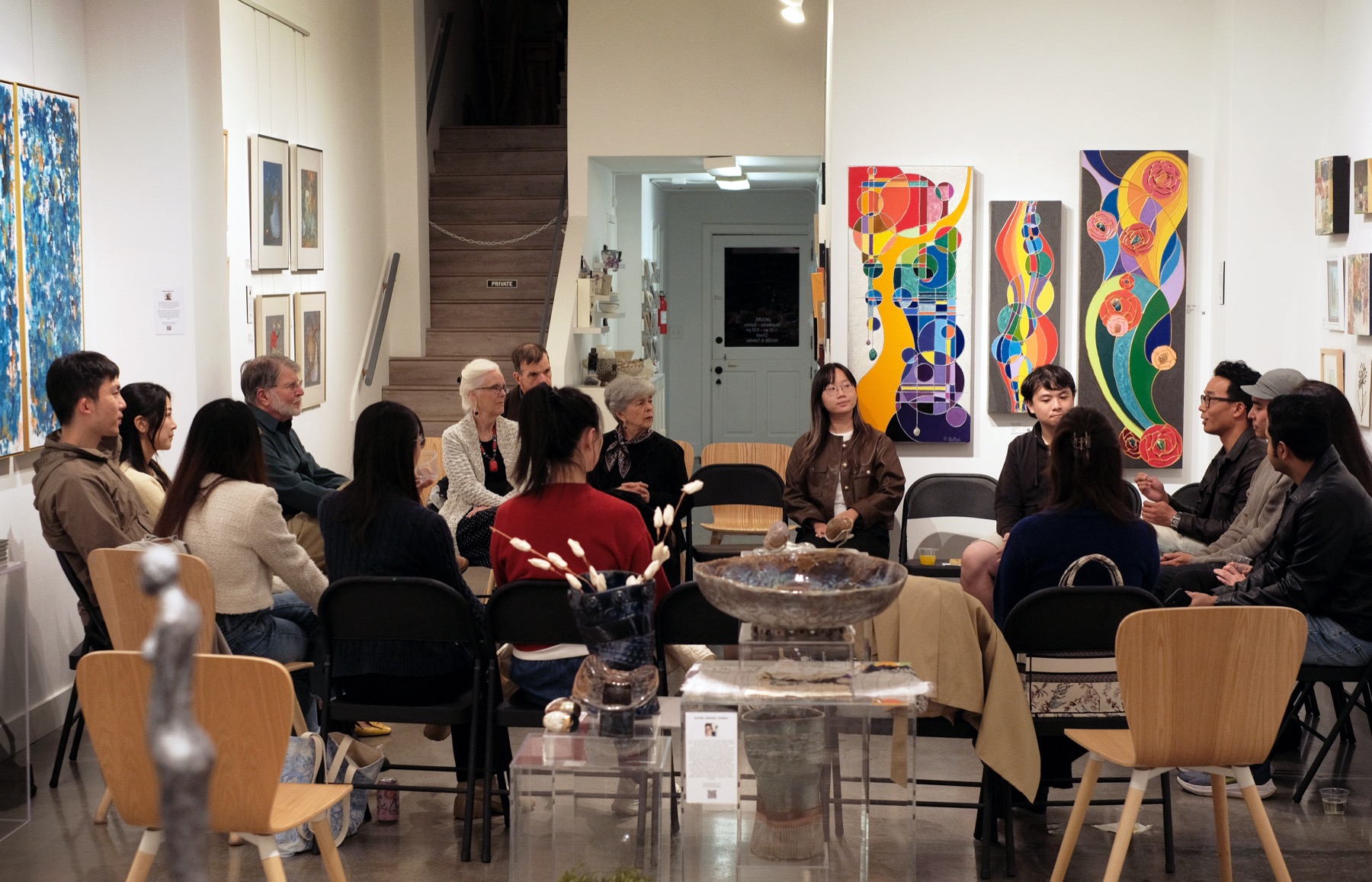 Participants seated in discussion inside Gallery House during AIC's second gathering.