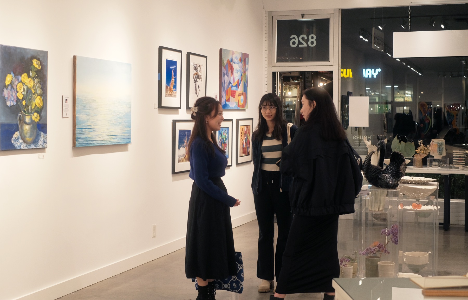 Participants talking in the gallery during the second AIC gathering.