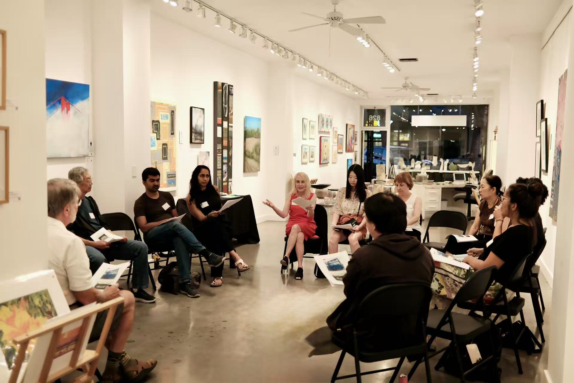Participants sharing ideas in a circle at Gallery House during the fifth AIC gathering.