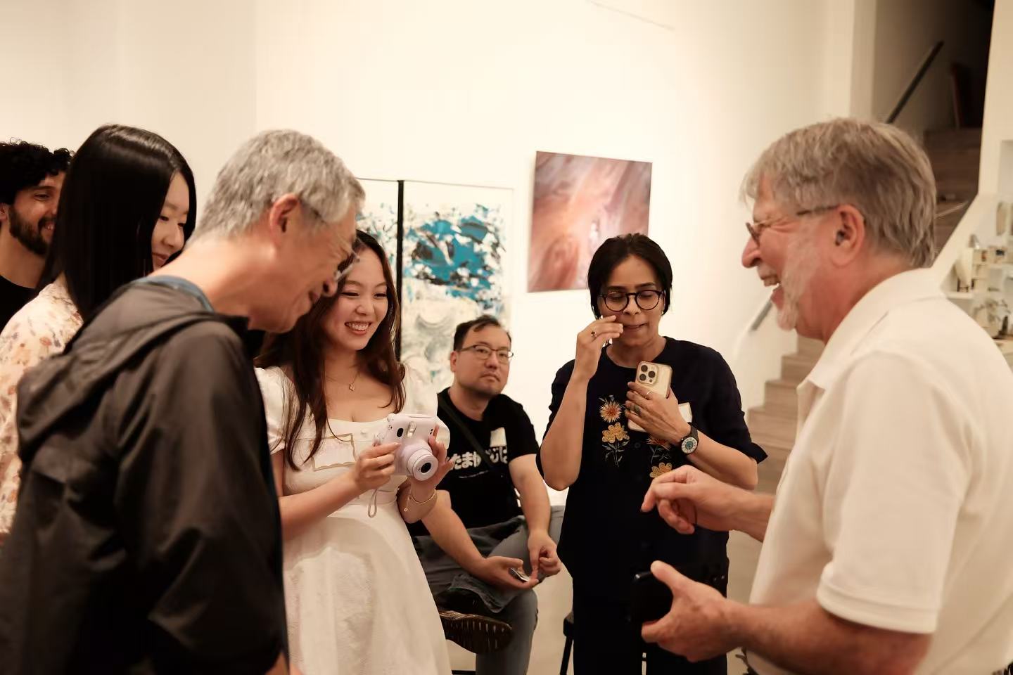 Participants chatting and sharing a moment together at the fifth AIC gathering.