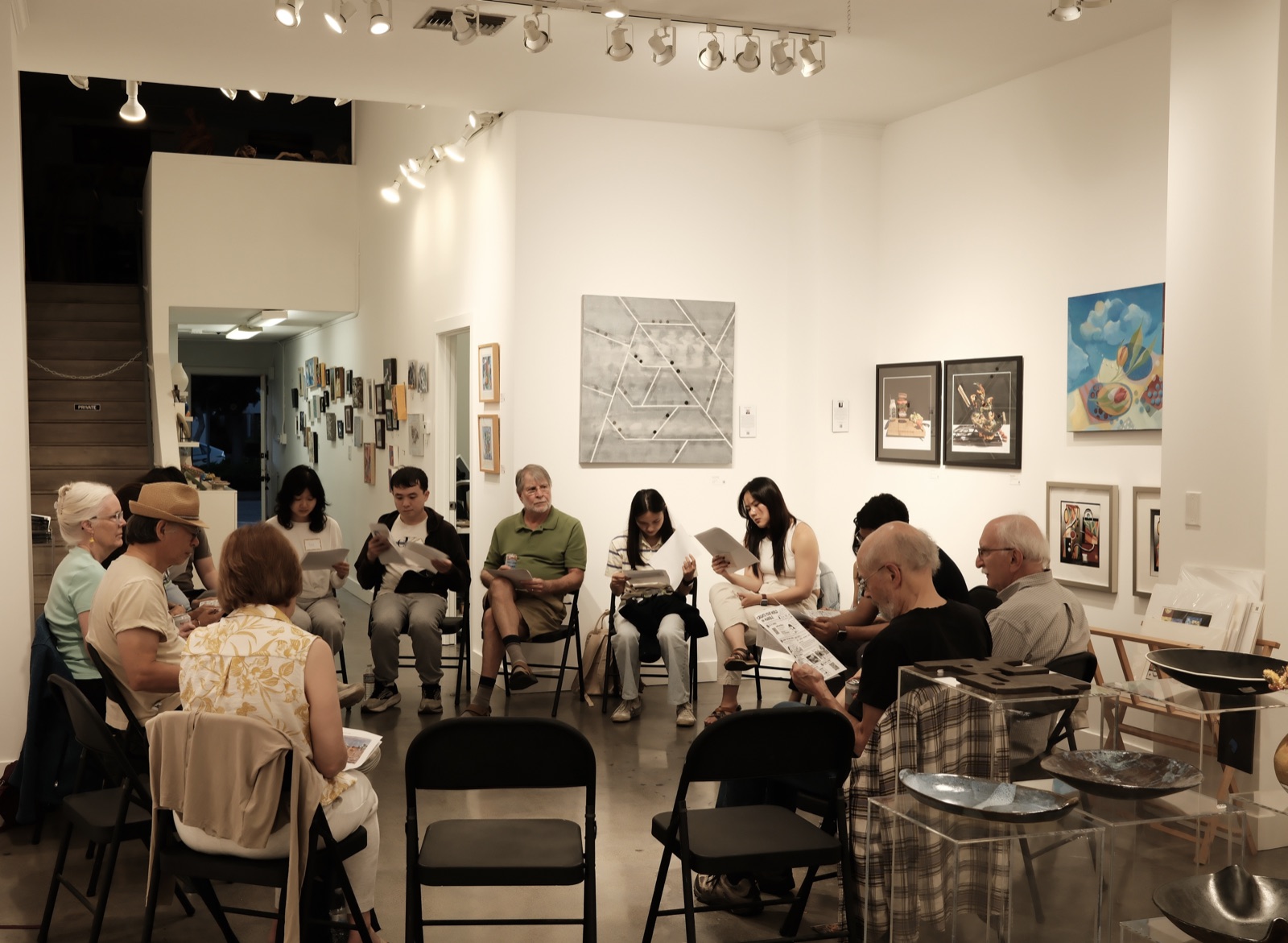 Participants seated together in a large circle at Gallery House during the sixth AIC gathering.